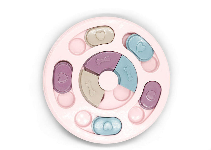 Close up of treat compartments on Soft Petal round slow feed dog puzzle toy.