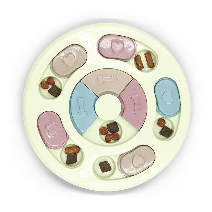 Close up of treat compartments on Budget Green round slow feed dog puzzle toy.
