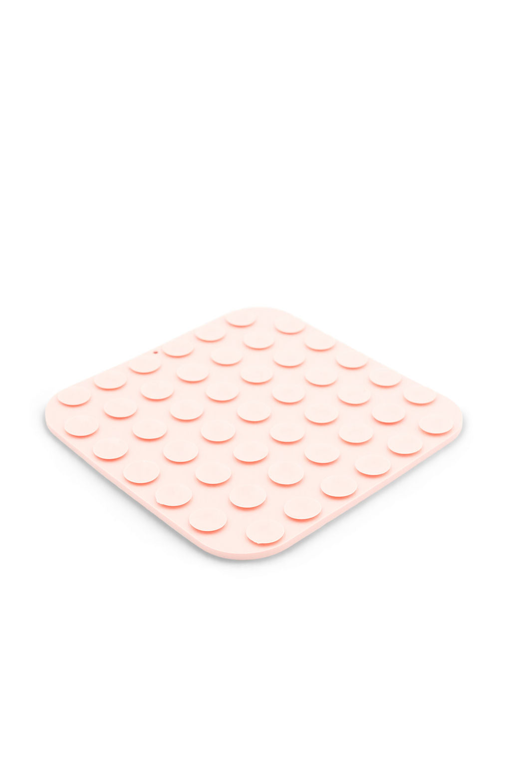 A square, light pink silicone mat with rounded corners and a raised circular stud pattern across the top, shown on a plain white background.