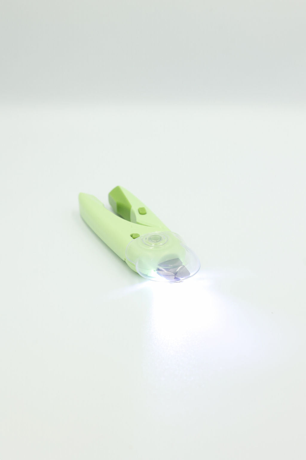 Side angle view showing the ergonomic grip of the BudgetPaws LED Pet Nail Clippers.