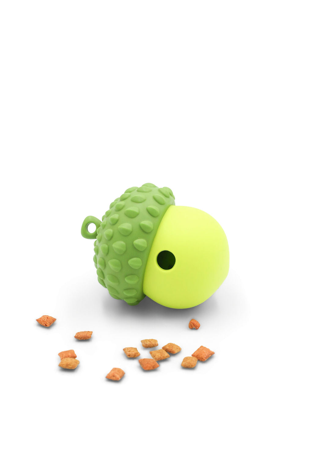 BudgetPaws Acorn treat dispensing cat toy in Budget Green with small dry treats scattered nearby, photographed on a white background.