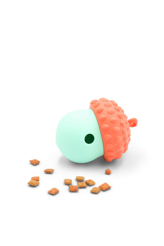 BudgetPaws Acorn treat dispensing cat toy in Sky Breeze blue with small dry treats scattered nearby, photographed on a white background.